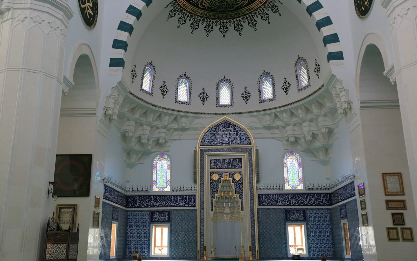 Interior of a grand mosque with a large dome